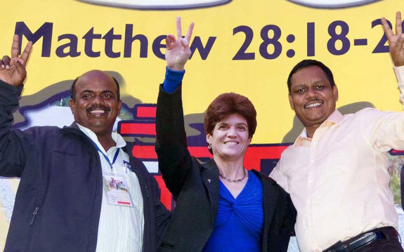 00-Leaders-in-front-of-stage-banner-2020-Conf-2014-Alok-David-Leanna-1200web-1