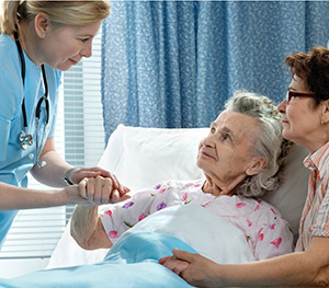 elderly_patient_bedside_doctor_care
